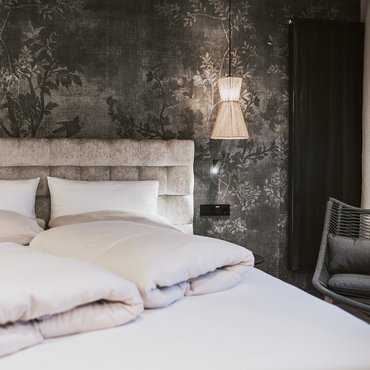 Panorama Restaurant Hotel Margarethenstein gemütliches Bett in der Auszeit Suite im Design Hotel Margarethenstein